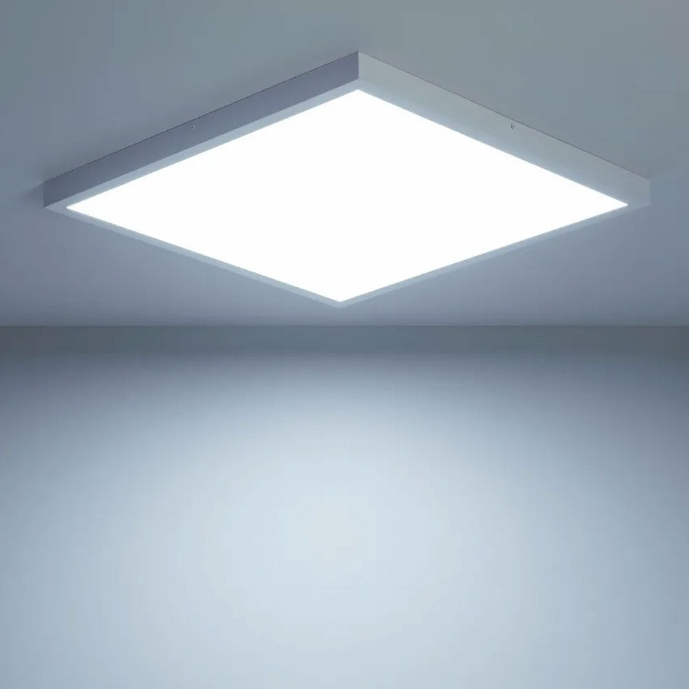 Illuminated 600x600 LED panel light surface mounted on an indoor ceiling